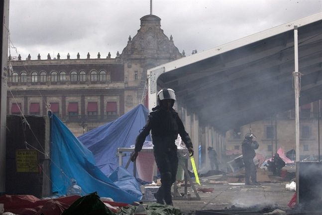 thesmithian:   Thousands of riot police retook Mexico City’s…Zócalo plaza…from