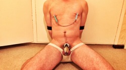 wenkhaus:  Boy is in a seated hogtie, o-gag still in. White speedo and chastity - if u look close you’ll see the spike bridle is still attached to his cock head in the cb6000- the chain is attached to his to toes behind him. Those nipple clamps have