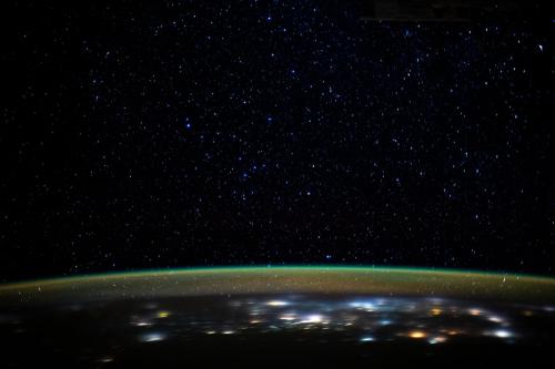 just&ndash;space:Glittering Lights of Earth As Seen From the Space Station : Stars glitter in the night sky above the Earth’s atmospheric glow. (via NASA)