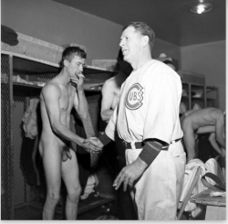 notdbd:  Chicago Cubs postgame clubhouse, 1945. Myron Davis of Life Magazine got photos of a few players in the nude as they gave interviews, smoked cigarettes, and shook hands. Hank Borowy. Phil Cavarretta. Charlie Grimm. Ray Prim. 