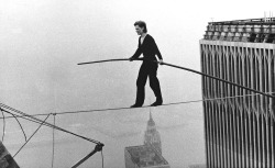Philippe Petit tightrope walking between the World Trade Center’s Twin Towers, August 7, 1974.