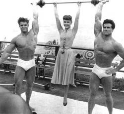 don56:  Body builders Dick Dubois and Steve Reeves host Debbie Reynolds in a publicity still foe “Athena” (1954)