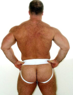 outmanned:  Proud coach strutting around the locker room in his jock, showing all the whelps what a grown man looks like.