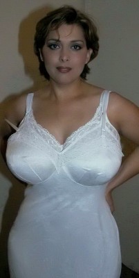 Grandma bras in action. Not sure I want to truly know why these garments speak to me. Does anyone know the name of this busty big-eyed beauty? 