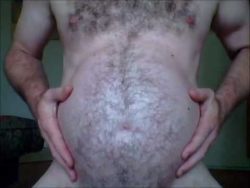 keepembloated: realmpreg:  voreguys:  Love the fur in this belly. nice and round ;)  https://www.youtube.com/channel/UCFQjYZG4xFUk3RPJQe1hanw  Gorgeous big hairy mpreg.   Growing rounder by the day! 