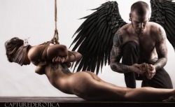 fineartofbondage:Awesome photo - Tied girl in suspension with a dark male angel next to her..breathtaking!Photo by capturederotica.com