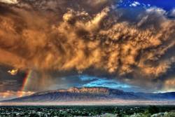 cybergata:  The Sandia Mountains near Albuquerque, New Mexico, even at over 10,000 feet in elevations seem small compared to the storm in the sky.  Taken in Corrales by Tom Spross
