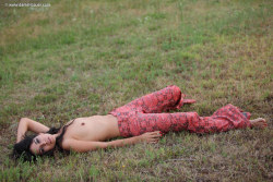 skinny hippie Yana relaxing topless in the grass. Photo Daniel Bauer