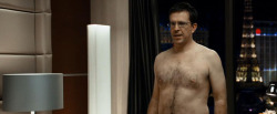 Ed Helms showing that hairy chest