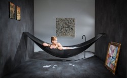 carlosison:  everything-creative:  This is a great idea!! The Vessel bathtub is made out of carbon-fiber and is hanging like a hammock. It is designed by Splinter works.  I WANT THIS!   