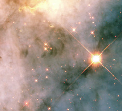 astronemma:  Turbulent Neighbourhood Near Eruptive Star  This image shows a region in the Carina Nebula between two large clusters of some of the most massive and hottest known stars.  Credit: NASA/ESA and The Hubble Heritage Team (AURA/STScI)