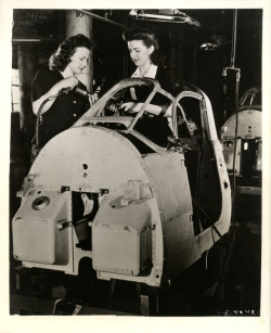 detroitlib:   View of Ruth Ripley and Rita Sabatini riveting a Kingcobra fighter plane cabin at the Hudson Motor Car Company factory. Label on back: “Hudson Motor Car Co., Detroit, Mich. Publication approved by Army Air Forces. Hudson builds Kingcobra