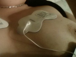 quicklymysticalwitch:  Here is my stab at a selfie  The pads are jolting me with electrical current and manipulating the surrounding muscles at the same time. There are two sets of pads for double the intensity  More pics to come