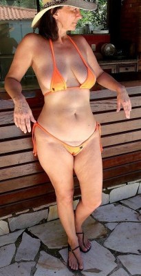 lovematureladysfeet:She knew that her boy often left his cum in this bikini slip. And she loves to wear it in front of him. Its exciting him so much that he explodes in his pants sometimes. 