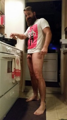 thebackyardboys:  Dressed in only his Adrian and Shane t-shirt, here’s hot-ass Harley slaving away, making yet another delicious dinner. Handsome, half-naked and he cooks well, too! Who’s hungry? 