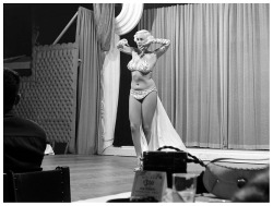 Mae Blondell           aka. “The Statuesque Blonde”..Dancing on stage for patrons at a Chicago nightclub, sometime in 1952..
