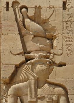 amntenofre:    the God Horus, falcon-headed, wearing a composite Double Crown with the two feathers and ram’s horns.  Temple of the Goddess Isis at Philae (now on the Agilkia island),detail from the lower register of the east tower of the First Pylon.