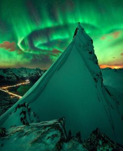 space-pics:  Aurora over Norway: Austnesfjorden fjord close to the town of Svolvear on the Lofoten islands in northern Norway. The time was early March. Our Sun has been producing an abundance of picturesque aurora of late as it is near the time of its