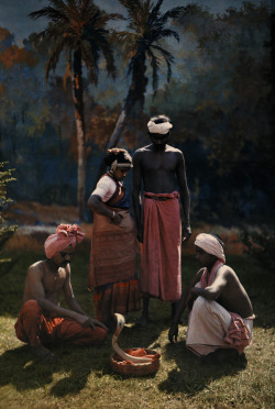 natgeofound:  A group of people gather round and watch a snake charmer at work in India, 1923.Photograph by Hans Hildenbrand, National Geographic 