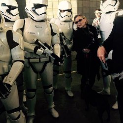 emeraldandochre:  I never knew my aesthetic goal would be Carrie Fisher in shades and all black, escorted by stormtroopers – but here we are.