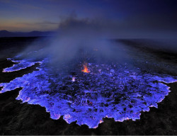 sixpenceee:Neon blue lava pours from Indonesia’s Kawah Ijen Volcano. The reason it’s blue is because the mountain contains large amounts of pure sulfur, which emits an icy violet colors as it turns. It turns the rocky slopes into a hot, toxic environment.