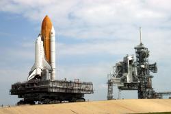 supplyside:  A crawler-transporter carrying Discovery travels the ramp to Launch Pad 39B. The vehicle’s back end can be raised, keeping the Shuttle and the MLP level