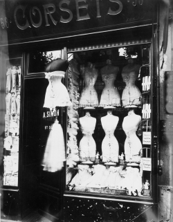 onlyoldphotography:  Eugène Atget: Boulevard de Strasbourg, Corsets, Paris, 1912  In Atget’s inventory of Paris, shop windows figure prominently and the most arresting feature mannequin displays. In the 1920s the Surrealists recognized in Atget a kindred