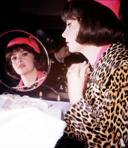 absolute-most:  Gina Lollobrigida trying on a string of pearls in a store in Tokyo, Japan (c. 1963) 