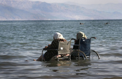 killing-the-prophet: Elderly Palestinian women sit in wheelchairs as they enjoy the waters of the northern part of the Dead Sea, in the West Bank, on October 2, 2008.Menahem Kahana