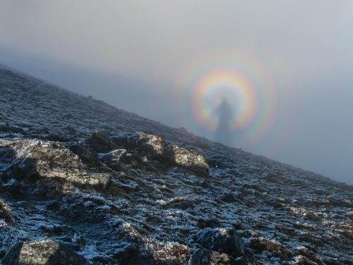 fectusing: Examples of a Brocken Spectre, a phenomenon where a person’s giant shadow appears magnified onto clouds miles away. The shadow from the sun behind the person creates a halo, giving it an angelic appearance. This mostly occurs on any misty