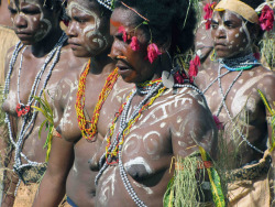 Topless Papuan women at the Lake Sentani Festival in Indonesia.