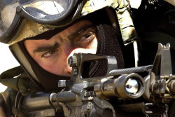 house-of-gnar:  Image of a Navy SEAL, taking aim with his M4A1 Carbine while securing a US Embassy for evacuation during excercise Desert Rescue X, June 18, 2002. U.S. Air Force photo by Staff Sgt. Aaron D. Allmon II  A US Army Chinook lifts off after