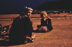 coltre:  This is a picture I took of my friends in a vacant parking lot last year. We spent part of the night there near the sea, talking and laughing without thinking about the future, looking at the lights of the city in front of us. I miss them so