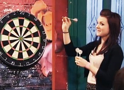 veruneedy:  Kathryn Prescott playing darts. 
