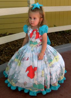 mydisneydaze:  Miss Lane wore her new dress to the Magic Kingdom today. I made it out of a vintage Little Mermaid bed sheet and the sleeves, bow, ruffle and starfish hair clip were made from an upcycled medical scrub top. Both were purchased from a thrift