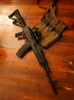 gunsngear:   AK-74  With surplus metal mag. (Polish, I think) The 3 mags in the bandoleer are Bulgarian surplus that were apparently painted black and sanitized of arsenal markings.  