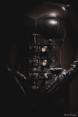 fotoarcade:  rubber corset with locking buckles over a latex catsuit December 2015 
