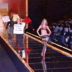 unpoly:  group of peta protesters storm the runway while an unbothered gisele bundchen remains composed and continues her walk @ the victoria’s secret show, 2002   Bc she&rsquo;s a goddamn professional