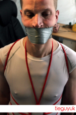 tieguyuk:  Another nice tight wrap around duct tape gag from this weeks update courtesy of BondNW. 