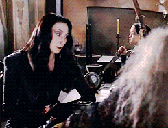 littleredhasalife:  supershawarmalock:  mmeadowss:  parenting done right  Never not reblog Morticia Addams  She just looks so uncomfortable at the notion of someone using such a small knife. 