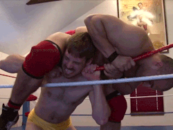 wrestling-abuse:  Putting his weight into the rope choke.