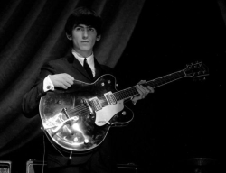 thateventuality:  George Harrison, onstage with The Beatles, 1963 Photo: Popperfoto “George [Harrison] was not a guy who woas using music to impress the world. He was trying to express something. He is one of the most important figures in early rock