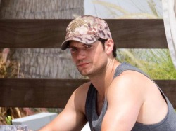 portalhenrycavillbr:  “Henry was photographed shirtless on the beach as and then at a hotel on South Beach, hanging with some friends by the pool and doing what appeared to be a shot at the bar. He showed off his muscles of steel as he wore a vest,
