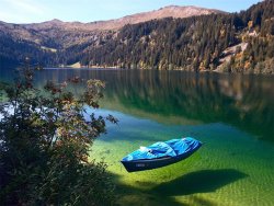 our-strange-yet-beautiful-planet:  Arnensee Lake, Switzerland   The waters of Arnensee in Switzerland are so clear they cause boats such as the one in the picture to appear as they are hovering in the air.  The lake is located in Canton of Berne in