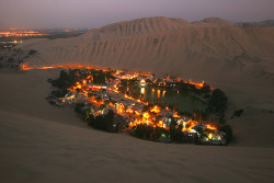 ocheano:  Tan YilmazHuacachina oasis, near Ica city, on the peruvian desert coast, taken from the top of the dunes at dusk.    this is where i live OMG FIRST PICTURE EVER FROM MY COUNTRY 