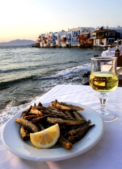yourlovelifeworld:  Greek Food and Wine in a sunset restaurant with Little Venice, Mykonos island, Greece. 