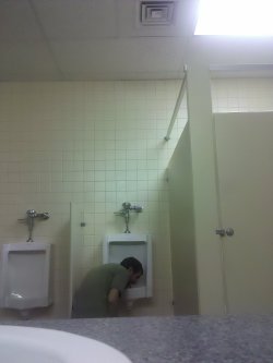 diapered-dumbfuck-dan:  This is me in the pic!  I have licked a urinal several times when no one was around, and only got caught once!  I would like someone to force me to do it it front of an audience some day!  If you want to be the one to do it