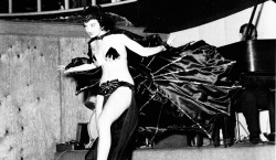 San San performs her &ldquo;Vampire Dance&rdquo; routine at the ‘5 O’Clock Club’ in Miami.. As photographed by Bunny Yeager..