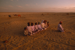 unrar: Evening prayer at the campsite of the Hamad Haraiz Harsousi Bedouin tribe. An excellent example of Harsousi tribal existence: this tribe, being a smaller on e, has been pushed into the harshest region of the Wahiba Sands desert. Oman, by James