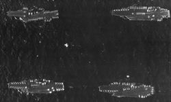 retrowar:Aerial view of the U.S. Navy aircraft carriers of “Battle Force Zulu” following the 1991 Gulf War: USS Midway (CV-41), upper left; USS Theodore Roosevelt (CVN-71), upper right; USS Ranger (CV-61), lower left; and USS America (CV-66), lower